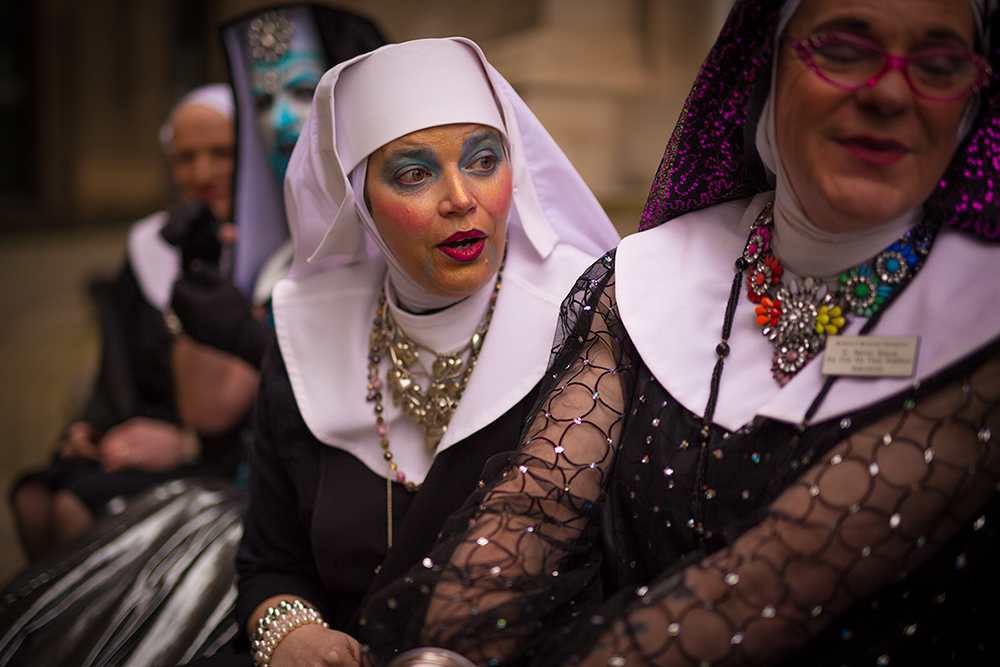 Sister Polly and Sister Martini looking at the Manchester Sisters calendar